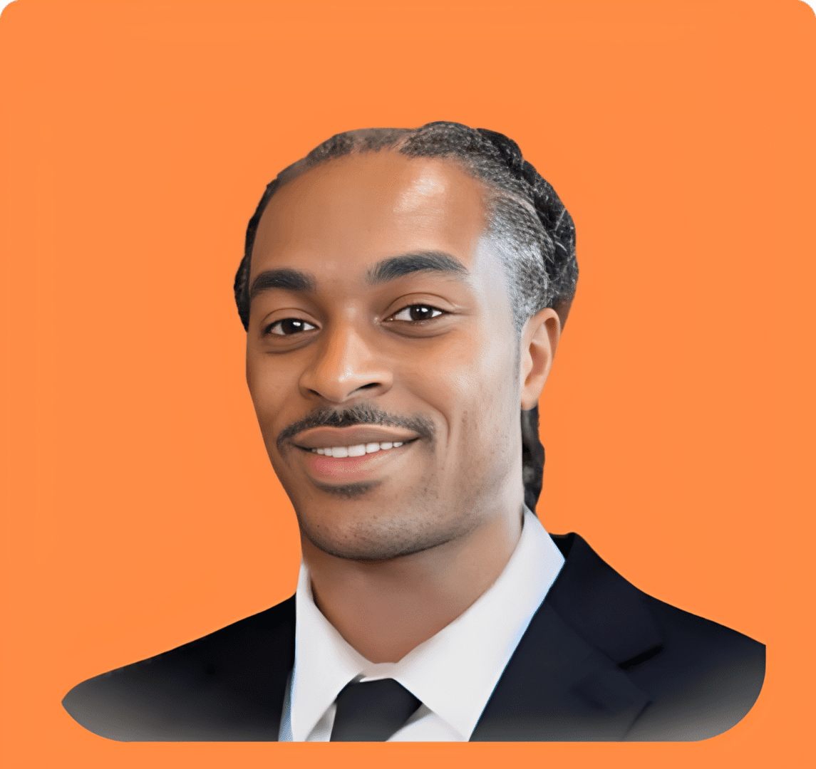 Smiling man in a suit on orange