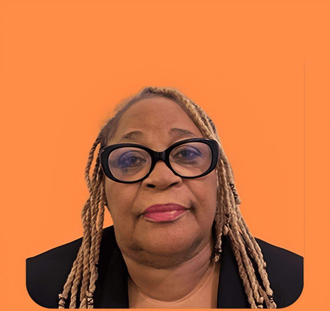 Individual in black jacket and glasses