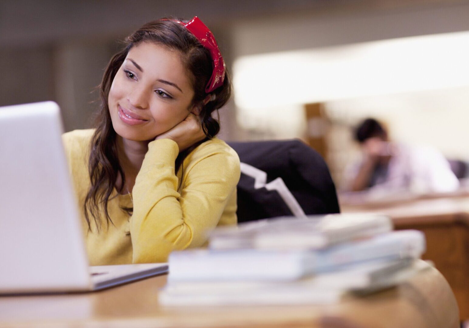 Student using laptop in library